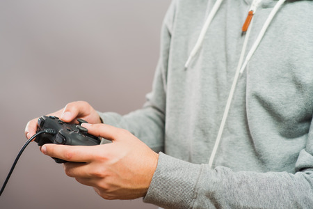 Young man with video game controllers