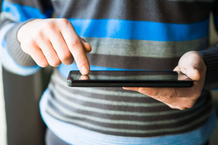 Businessman holding digital tabletの写真素材