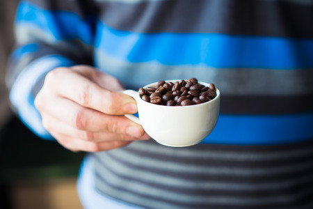 coffee grains of the handの写真素材