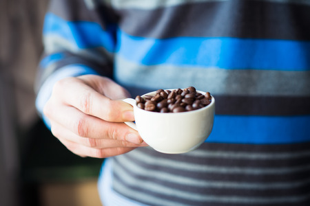coffee grains of the handの写真素材