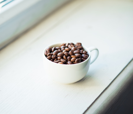 coffee cup and beans, cinnamon sticksの写真素材