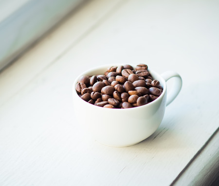 coffee cup and beans, cinnamon sticksの写真素材