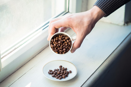 coffee cup and beans, cinnamon sticksの写真素材