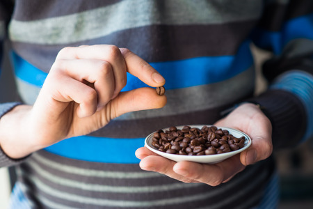 coffee grains of the handの写真素材