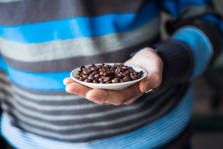 coffee grains of the handの写真素材