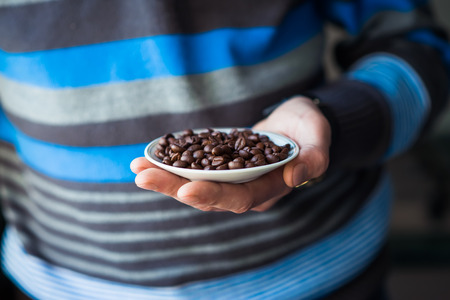 coffee grains of the handの写真素材