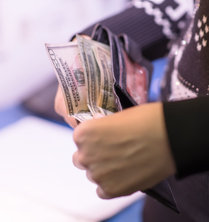 Money in the hand (Hand with money, Hand holding Banknotes)の写真素材