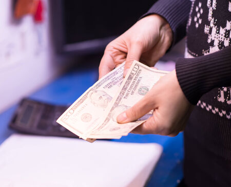 Money in the hand (Hand with money, Hand holding Banknotes)の写真素材