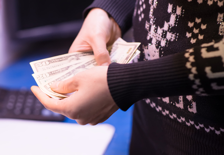 Money in the hand (Hand with money, Hand holding Banknotes)の写真素材