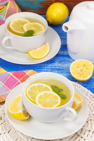 Tea. Two cups of tea with lemon and mint. Macro, selective focusの写真素材