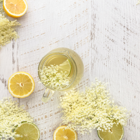 Elderflower syrup. Homemade elder flower syrup with a slice of lemon. Top view with copyspaceの写真素材