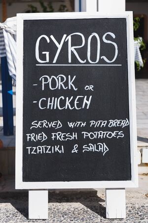 Blackboard of a restaurant with gyros menu, favourite street food in Greeceの写真素材