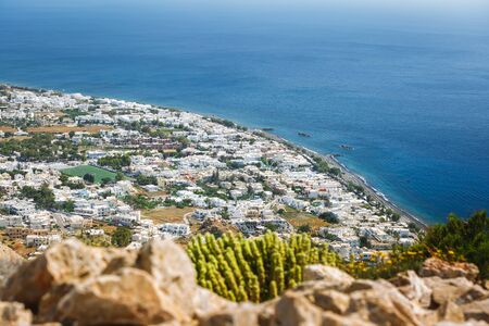 Aerial view of the town of Kamari, and beach, Santorini island,  Greeceの写真素材