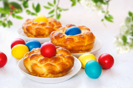 Traditional Italian Easter bread rolls on table,  ready to eat. Happy Easter background for advertising, banner or greeting card. Selective focusの写真素材