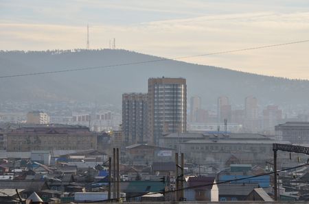 This picture shows a modern building with mountain backgroundの写真素材