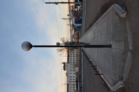 This picture shows a row of lampposts alignedの写真素材