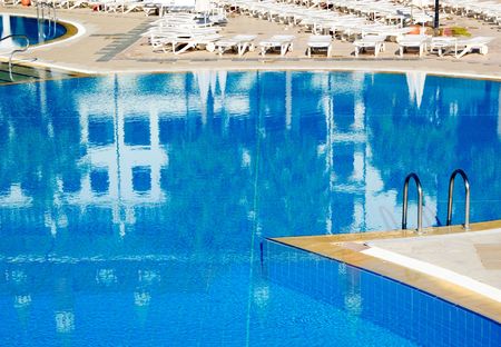 Swimming pool with hotel building reflection, Antalya, Turkey