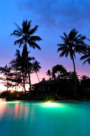 Sunset and illuminated swimming pool, Bentota, Sri Lankaのeditorial素材