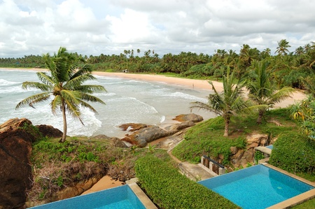 Beach view swimming pools at luxury villas and turquoise water of Indian Ocean, Bentota, Sri Lankaのeditorial素材
