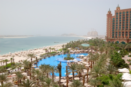 The beach and swimming pool at luxury hotel, Dubai, UAEのeditorial素材