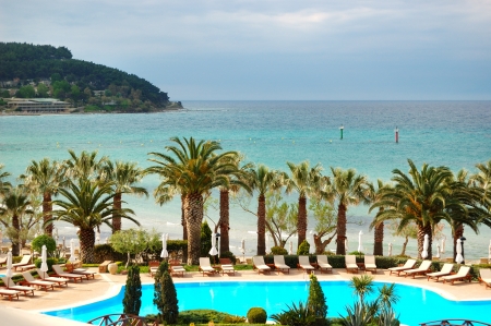 Swimming pool by a beach at the modern luxury hotel, Halkidiki, Greeceのeditorial素材