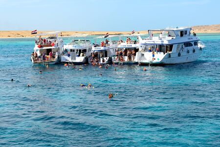 HURGHADA, EGYPT -  DECEMBER 6: Snorkeling tourists and motor yachts on Red Sea. It is popular tourists destination on December 6, 2012 in Hurghada, Egyptのeditorial素材