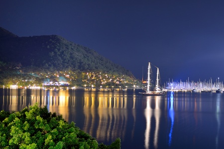 Yachts at the pier and beach in night illumination, Marmaris, Turkeyの写真素材