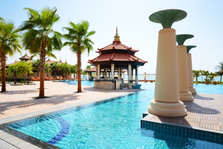 The swimming pool near beach in Thai style hotel on Palm Jumeirah man-made island, Dubai, UAEのeditorial素材