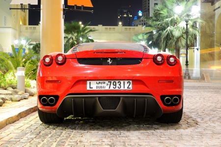 DUBAI, UAE - SEPTEMBER 12: The luxury sport car is on the Walk at Jumeirah Beach Residence on September 12, 2013 in Dubai, United Arab Emirates. In the city of artificial channel length of 3 kilometers along the Persian Gulf.のeditorial素材