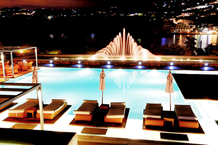 Swimming pool with fountain in night illumination at the luxury hotel, Crete island, Greeceのeditorial素材