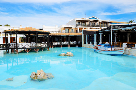 Open-air restaurant and swimming pool at luxury hotel, Crete, Greeceのeditorial素材