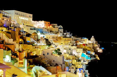 FIRA, GREECE - MAY 18: The tourists enjoiying their vacation on Santorini Island on May 18, 2014 in Fira, Greece. Up to 16 mln tourists is expected to visit Greece in year 2014.のeditorial素材