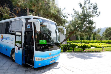 ANTALYA, TURKEY - APRIL 25: The modern bus for tourists transportation is near entrance to hotel on April 25, 2014 in  Antalya, Turkey. More then 36 mln tourists have visited Turkey in year 2014.のeditorial素材