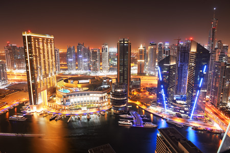 DUBAI, UAE - SEPTEMBER 8: The night illumination of Dubai Marina on September 8, 2013 in Dubai, UAE. It is an artificial canal city, built along a two mile (3 km) stretch of Persian Gulf shoreline.のeditorial素材