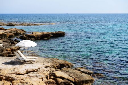 The sunbeds on a beach at luxury hotel, Crete, Greeceの写真素材