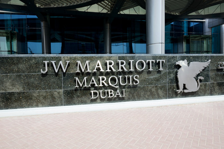 DUBAI, UAE - SEPTEMBER 10: The entrance of JW Marriott Marquis Dubai hotel on September 10, 2013 in Dubai, UAE. It is the worlds tallest hotel.のeditorial素材
