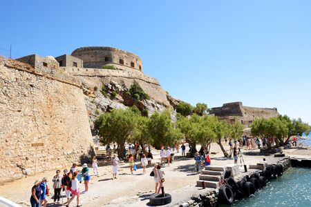 SPINALONGA, GREECE - MAY 14: The tourists are on Spinalonga island on May 14, 2014 in Spinalonga, Greece. Up to 16 mln tourists is expected to visit Greece in year 2014.のeditorial素材