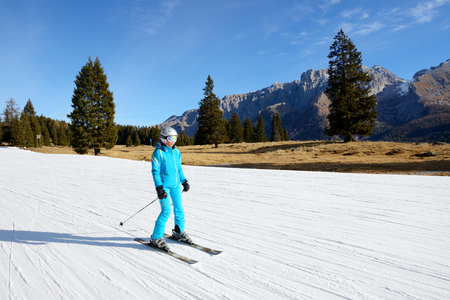 MADONNA DI CAMPIGLIO, ITALY - DECEMBER 18: The ski slope and skier at Passo Groste ski area on December 18, 2015 in Madonna di Campiglio, Italy. More then 46 mln tourists is expected to visit Italy in year 2015.のeditorial素材