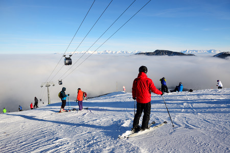 JASNA, SLOVAKIA - JANUARY 25:  The skiers are on slope and fog in Jasna Low Tatras. It is the largest ski resort in Slovakia with 49 km of pistes on January 25, 2017 in Jasna, Slovakiaのeditorial素材