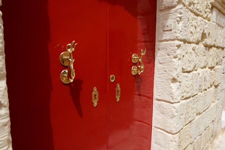 The red door of house at Mdina town, Malta