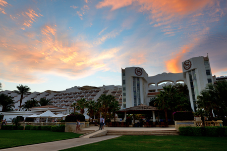 SHARM EL SHEIKH, EGYPT -  DECEMBER 2: The tourists are on vacation at popular hotel in sunset on December 2, 2013 in Sharm el Sheikh, Egypt. Up to 12 million tourists have visited Egypt in year 2013.のeditorial素材