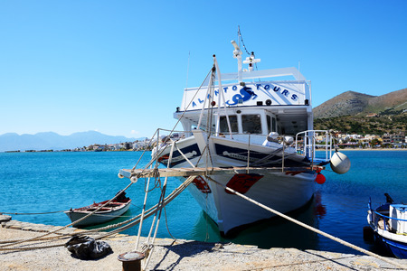 PLAKA, GREECE - MAY 14: The motor yacht tour to Spinalonga island on May 14, 2014 in Plaka, Greece. Up to 16 mln tourists is expected to visit Greece in year 2014.のeditorial素材