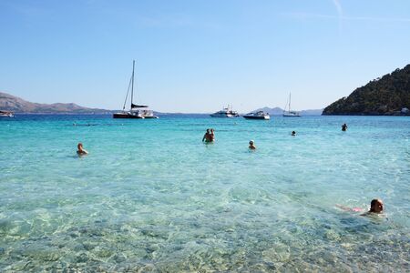 MALLORCA, SPAIN - JUNE 1: The tourists enjoiying their vacation on the beach on June 1, 2015 in Mallorca, Spain. Up to 60 mln tourists is expected to visit Spain in year 2015.のeditorial素材