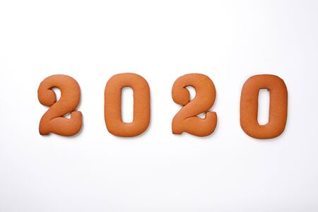 The hand-made eatable gingerbread 2020 inscription on white backgroundの写真素材