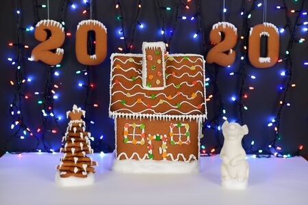 The hand-made eatable gingerbread house, mouse - symbol of year 2020, New Year tree, 2020...