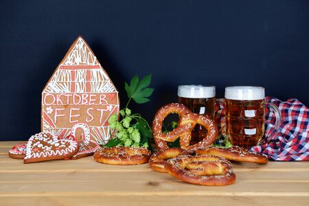 The hand-made eatable gingerbread house, beer, hops, pretzels for Octoberfest partyの写真素材