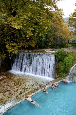 LOUTRA, ARIDEA, GREECE-OCTOBER 13: The tourists swimming in water from hot springs in Loutra, Aridea...