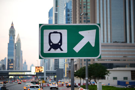 DUBAI, UAE - NOVEMBER 15: The metro station road sign and Sheikh Zayed road on November 15, 2019 in Dubai, UAEのeditorial素材