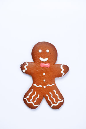 The hand-made eatable gingerbread little man on white backgroundの写真素材