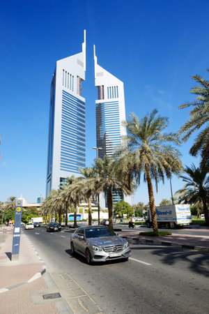 DUBAI, UAE - NOVEMBER 19: The Emirates Towers and Mercedes E-klass car on November 19, 2017. The Emirates Towers complex is set in over 570,000 m2のeditorial素材